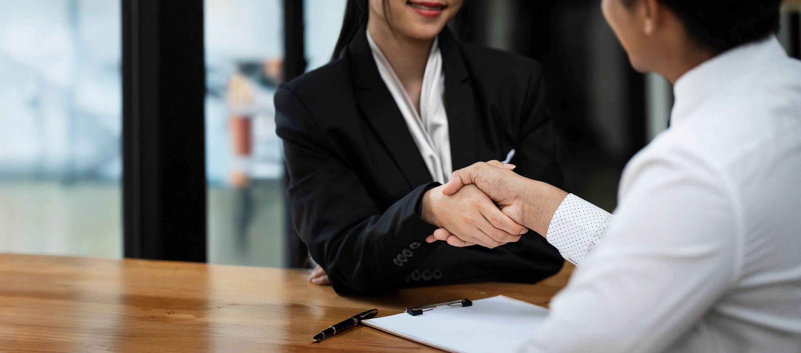 Professional handshake representing agreement and trust
