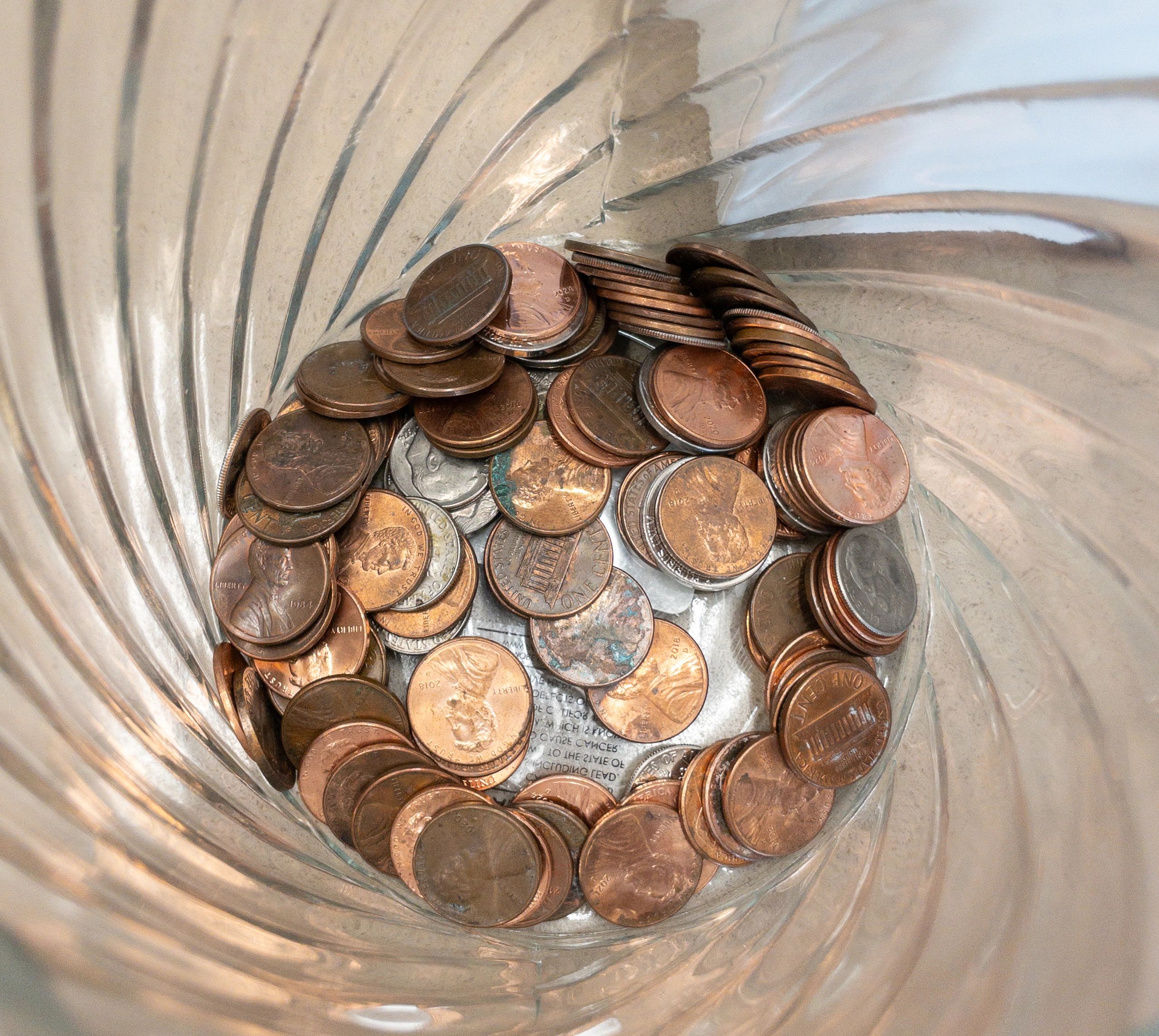 Glass jar with coins representing savings growth